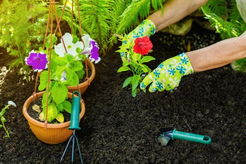Landscaping in Burnt Oak with a neat garden and patio